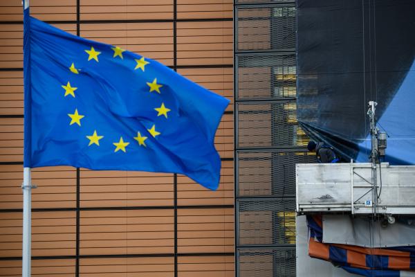 The banner 'NextGenerationEU' on the front of the Berlaymont building
